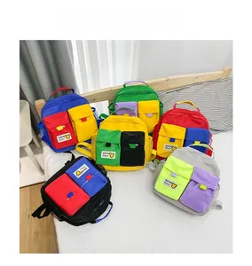 Close-up of colorful canvas backpacks with dual front pockets and mesh side pockets