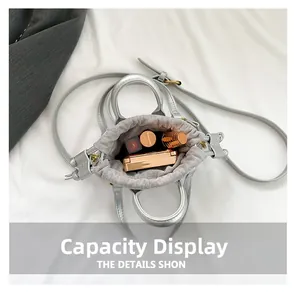 Top view showing the internal capacity of the silver bucket bag with cosmetics