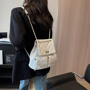 White quilted faux leather backpack with chain straps and gold twist-lock pockets