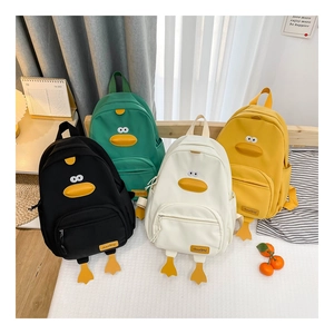 Detail of cute duck backpacks in four colors showing 3D duck eyes and beak features