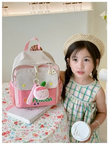 Pink and beige canvas backpack for girls with cartoon pendant and alphabet print