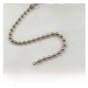Detail of a bright silver metal bead chain for mini handbags and shoulder bags
