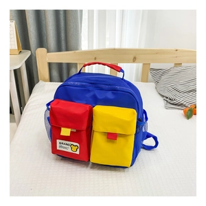 Detail of color-block kids backpack with multiple pockets and durable nylon fabric