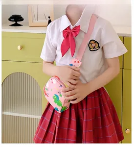 Detail show of girls pink dinosaur chest bag with cartoon patterns and adjustable strap