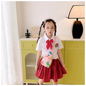 Girl's pink dinosaur chest bag with adjustable strap worn as a stylish crossbody bag
