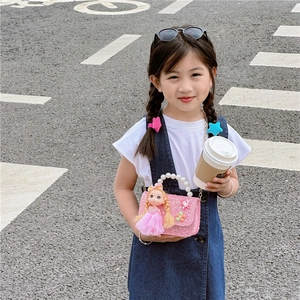 Pink sequin girls' handbag with doll pendant, floral accents and pearl handle for kids