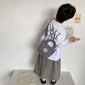 Kids corduroy tote bag in grey with cute bear patch and adjustable shoulder strap
