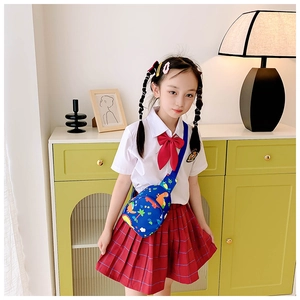 Close-up of blue children dinosaur chest bag with cartoon prints and adjustable shoulder strap