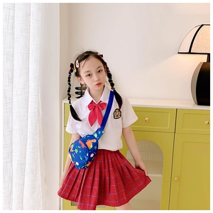 Close-up of girl wearing a dark blue dinosaur pattern chest bag with adjustable strap