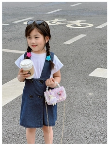 Girl's purple sequin crossbody bag with pearl handle and bunny plush detail