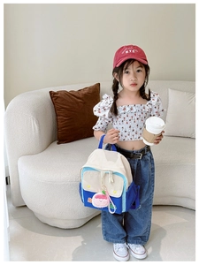Toddler canvas backpack with contrast colors and cute peach plush pendant detail