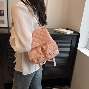 Pink quilted faux leather backpack for women with gold chain straps and metal twist locks