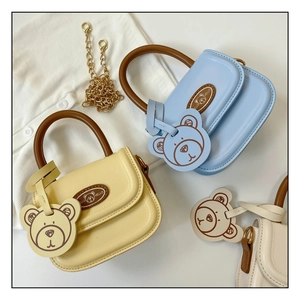 Three mini bear handbags in pastel colors with gold chain and plush toy charms