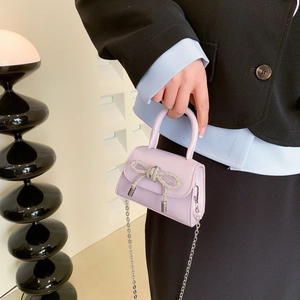 Chic lilac mini handbag with sparkling rhinestone bow and silver chain strap for women