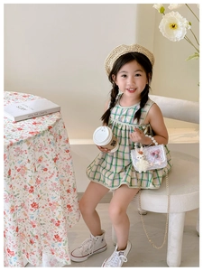 Detail of girls' mini princess purse featuring pearl handle and cute rabbit decoration