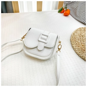 Detail of white lychee leather mini crossbody bag with a square buckle on checkered cloth