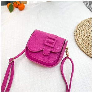 Detail of rose red mini crossbody bag featuring premium lychee texture PU leather