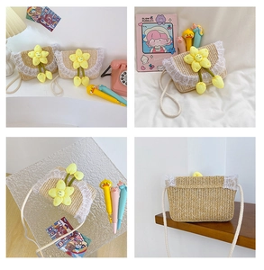 Close-up of children's woven straw bag with white lace trim and yellow sunflower detail