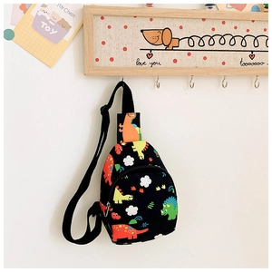 Close-up of kids dinosaur chest bag with colorful prints and adjustable black strap