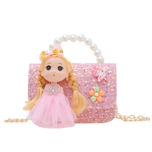 Pink sequin girls crossbody bag with pearl handle and golden doll decoration