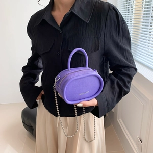 Mini purple pebble leather crossbody bag with silver metal chain and handle