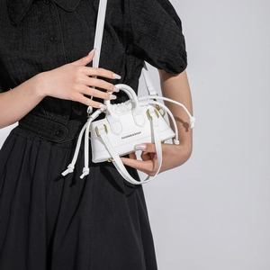 Mini white trapezoid handbag with dual top handles and drawstring closure for women