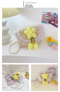 Detail of off-white straw woven kids bag with yellow plush flower and white lace trim