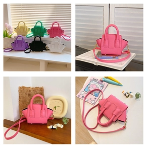 Detail view of mini winged tote bags in various colors with litchi texture and crossbody straps