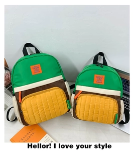 Detail of color-block nylon kid's backpack set featuring cute Happy Rabbit logo patch