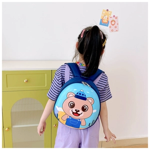 Detailed back view of a blue toddler backpack with hard shell bear design and adjustable straps