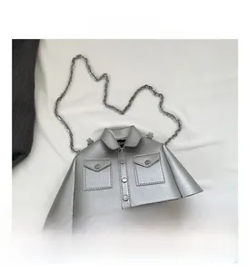 Detailed view of creative silver shirt-shaped metal chain bag with collar and button accents