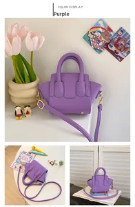 Detail of purple lychee pattern mini tote with golden hardware and adjustable strap