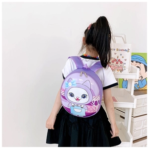 Rear view of a purple hardshell cat backpack worn by a toddler in a bright room