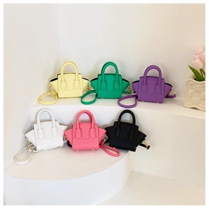 Detail view of six colorful mini princess handbags with double handles and gold hardware