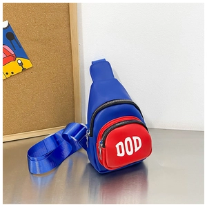 Detail of red and blue PU leather mini chest bag with adjustable strap and DOD lettering