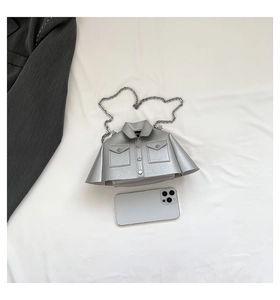 Detailed view of creative silver jacket-shaped chain bag with pockets and buttons