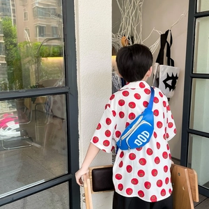 Kids trendy crossbody chest bag in vibrant blue with DOD logo and tomato print shirt