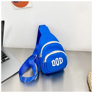Detail of bright blue children's mini crossbody bag with white DOD letters and dual zippers