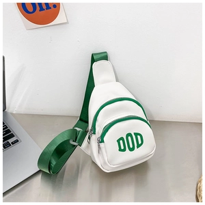 Detail of white PU leather kids chest bag with green adjustable nylon strap and DOD logo