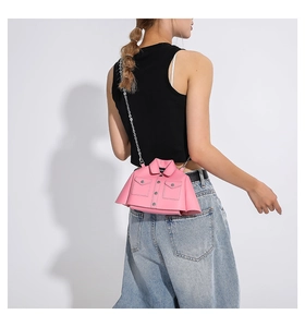 Detail of pink creative shirt-shaped mini bag with silver chain and collar design