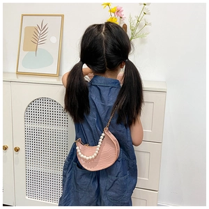 Pink crescent crossbody bag for girls with pearl handle and golden chain detail