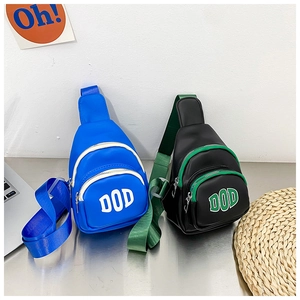 Detail view of mini PU leather chest bags for kids with DOD logo and contrast zippers