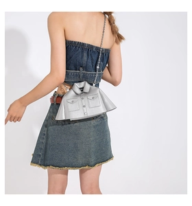 Detailed back view of a silver jacket-shaped crossbody bag with a metal chain strap