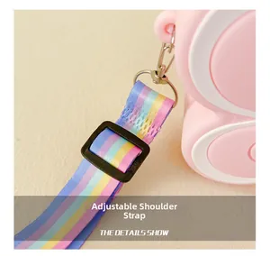 Detail of pink silicone bag with adjustable rainbow strap and metallic lobster clasp