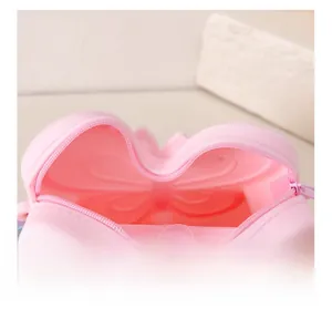 Detail showing the internal storage space and pink zipper of the butterfly silicone bag