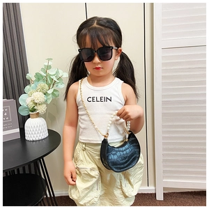 Detailed view of kids crocodile pattern semi-circle bag with pearl handle and gold chain
