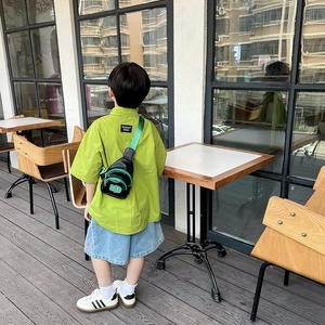 Kids green shirt and denim shorts set with black and green crossbody chest bag