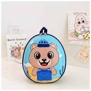 Front view of a blue egg-shaped hardshell kids backpack with cute cartoon bear pattern