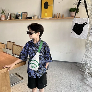 Kids fashion PU chest bag with contrast letters for boys shown in stylish outfit