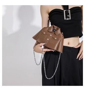Creative brown jacket-shaped crossbody bag featuring silver chain strap and collar details